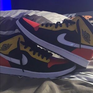 Orange and yellow Jordan 1’s